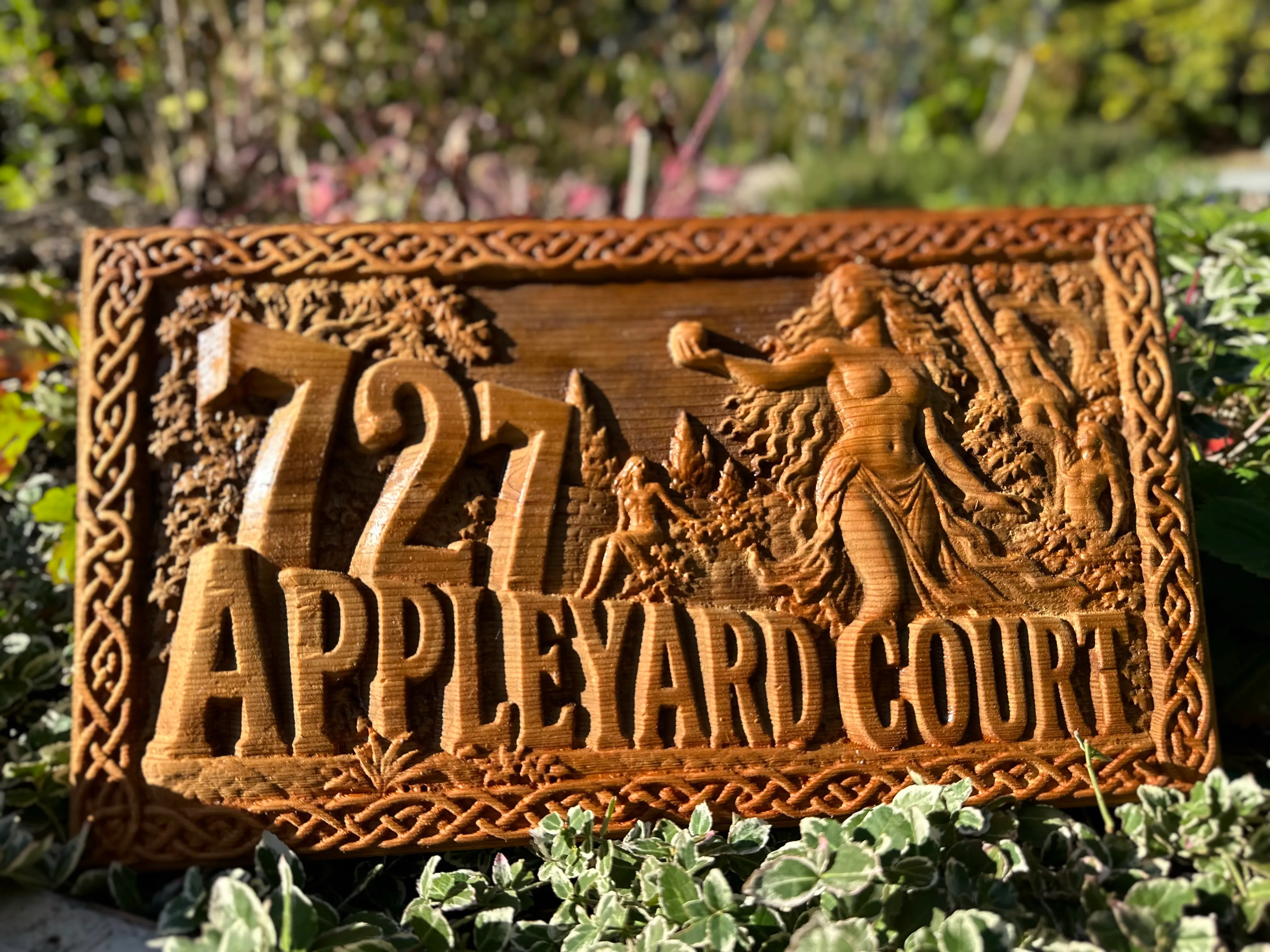 Celtic Garden style: 727 Appleyard Court sign with knotwork border and classical figures in a garden