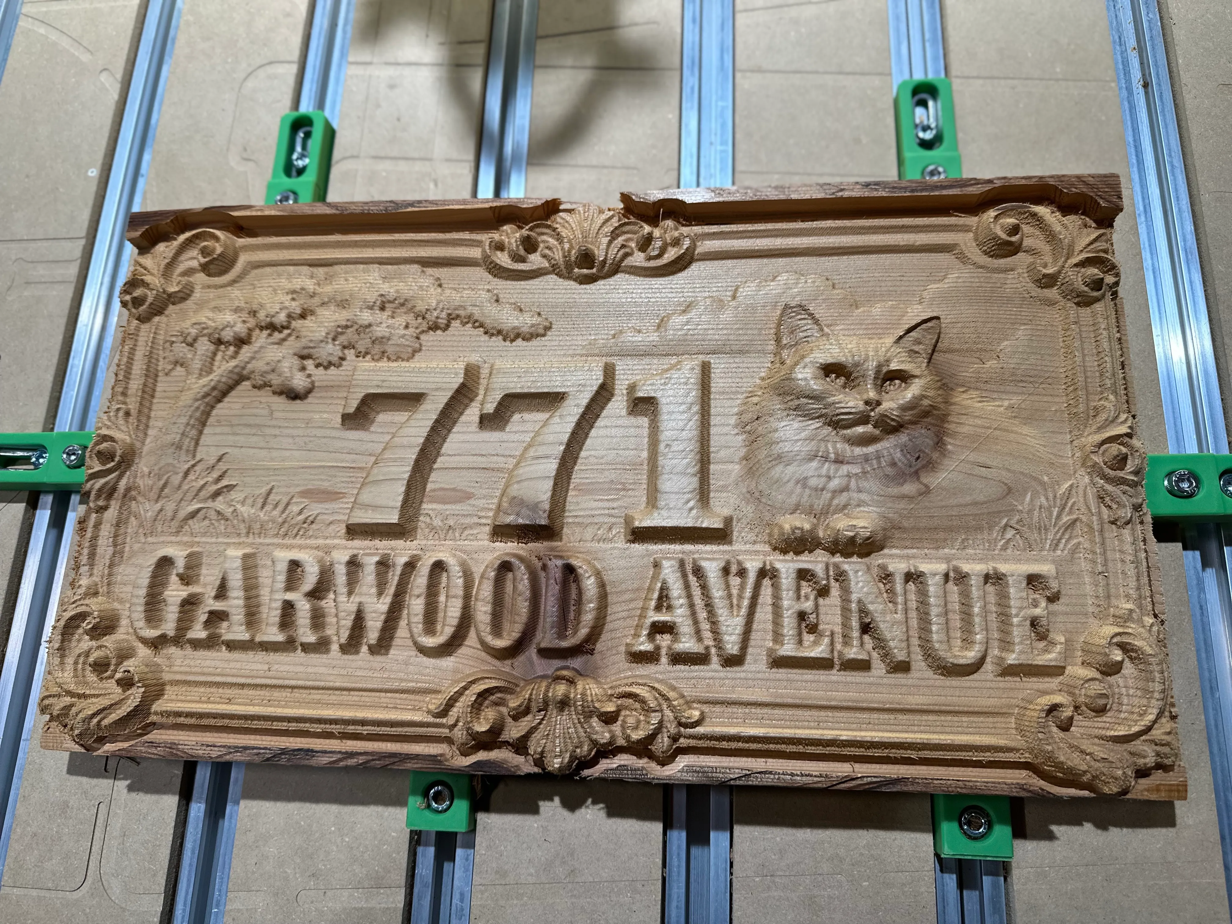 Victorian Pet style: 771 Garwood Avenue sign with a carved cat portrait and ornate scrolled corners